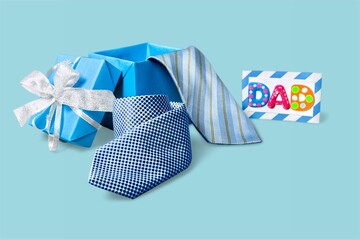 Happy Fathers Day background. Necktie on pastel blue table.