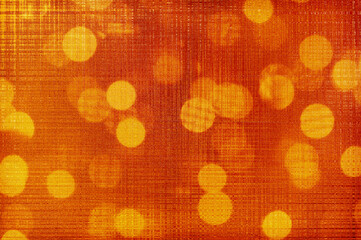 Abstract festive orange background with light bulbs.