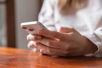 Anonymous woman browsing smartphone