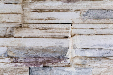 Decorative stone wall pattern Stone cladding background and wallpaper. The texture of the wall of the building.