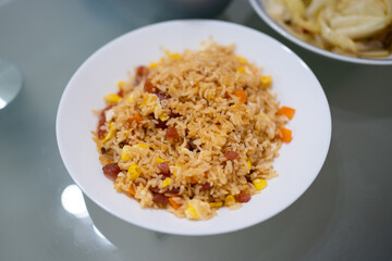 Home cook pork sausage fried rice in white plates
