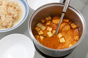 Home cook Thai Tomyam spicy soup in pot
