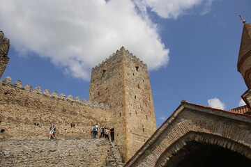 Fototapeta na wymiar Tourists on the wall of the Ananuri fortress