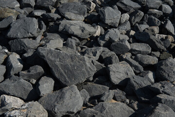 black rough  stone background and texture.Selective focuc.