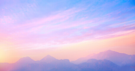 Fototapeta na wymiar sunrise cloudy sky over mountains; Abstract colorful peaceful sky background