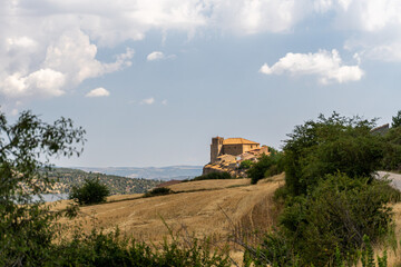 Fototapeta na wymiar Rural landscape with the beautiful church of Moscardón in the background, in Teruel (Spain)