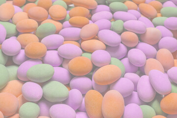 Group of colorful peanuts in glaze.