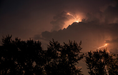 Night thunderstorm, lightning in the clouds