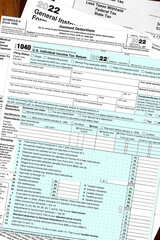 2022 IRS tax forms on a desktop.