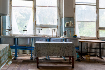 A place for washing dishes in an old abandoned dining room