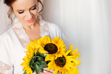 Bride with a bouquet of flowers close-up. Wedding, relationship and love concept.
