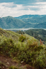 View with mountains, river Katun and valley from top of the rock - devil's finger - in the mountainous Altai, Russia