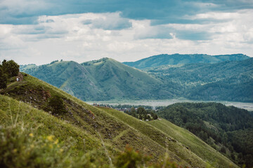 View with mountains, river Katun and valley from top of the rock - devil's finger - in the mountainous Altai, Russia