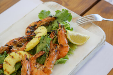 Grilled pineapple snd shrimp salad with citrus dressing - delicious salad full of nutrients and minerals that can be served on the side or as a main dish.