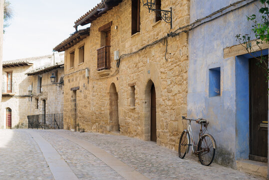 Picturesque spanish old town street with an old bicycle