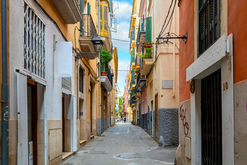 A narrow colorful street in the historic old town of Palma de Mallorca, on the Balearic island of Mallorca, Spain. © Kirk Fisher