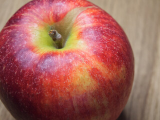 A  single large ripe gala apple, a macro  shot. Beautiful fruit.