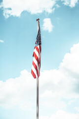 american flag against blue sky