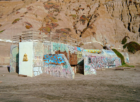 Old cement ruins with graffiti at the beach at Fort Funston in California