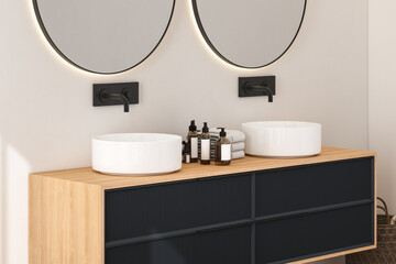 Fototapeta na wymiar Close up of modern bathroom cabinet with white wall, double sink standing on wooden countertop and two round mirrors. 3d rendering