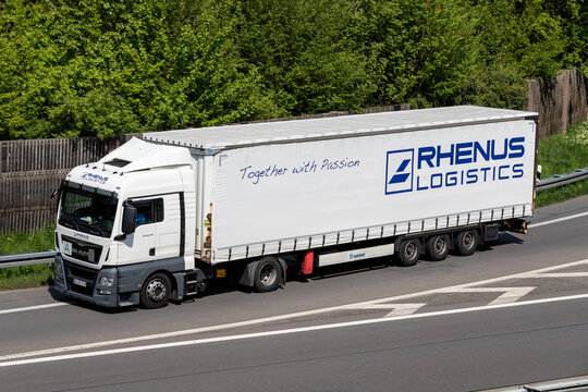 WIEHL, GERMANY - MAY 3, 2022: Rhenus Logistics MAN TGX truck with curtainside trailer on motorway