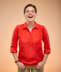 Happy laughing young lady in red shirt isolated portrait.