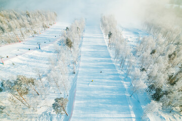 top view of the ski winter track, white snow and trees in the snow