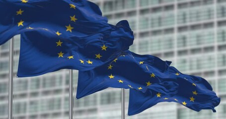 group of flags of the European Union waving in the wind - Powered by Adobe