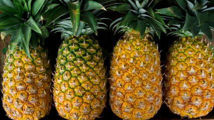 Yellow pineapples in the store