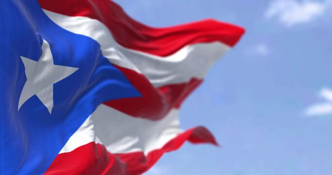 Flag of Puerto Rico waving in the wind on a clear day