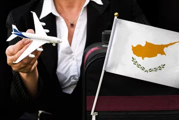 Foto op Canvas business woman holds toy plane travel bag and flag of Cyprus  © mirsad