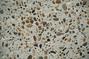 Texture small pebbles filled with concrete