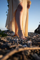 The bride's walk on the beach of pebbles