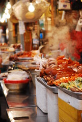Night food market in Seoul South Korean with food and steam under lights