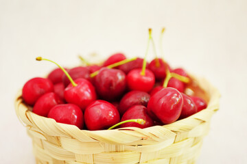 Close up Red cherries in basket. Summer berries harvest. Healthy eating. 