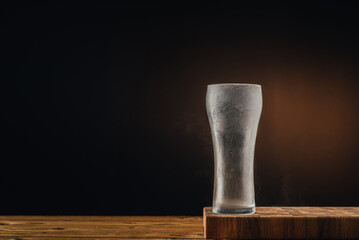 Empty beer glass covered with frost