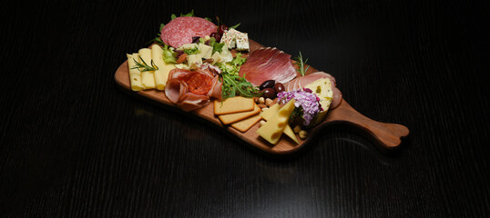 Appetizers table with differents antipasti, charcuterie, snacks and cheese. Buffet party. Top view, copy space