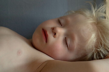 portrait of a cute blond child sleeping