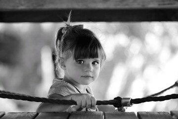 little girl is playing on the playground 