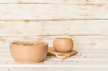 Bowls with wholegrain spelt farro on wooden table