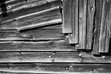 Old boards. Wooden background from old boards. Wood texture on dark wooden planks arranged in a random manner.