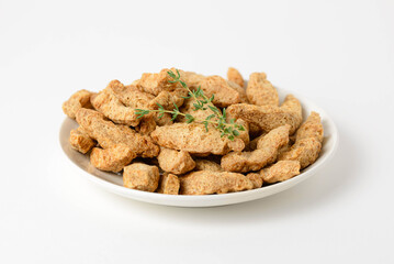 Textured soy protein or soy meat in a white plate isolated on white background