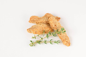 Macro photo of textured soy protein or alternative meat with thyme isolated on white background
