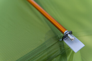fastening details of a modern tourist tent with an outer frame close-up