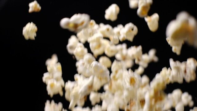 Popcorn flies slowly. Closeup food video