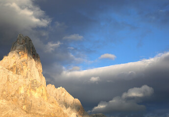 Peak of mountain called CIMON DELLA PALA in Northen Italy with orange color at sunset due optical...