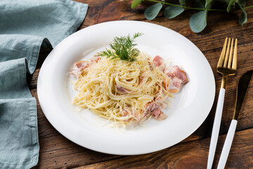 Pasta Carbonara on wooden background