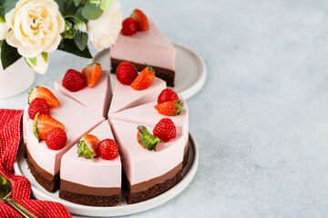 Sweet breakfast, delicious cheesecake with fresh strawberries and mint, homemade recipe without baking, on white stone table. Copy space.