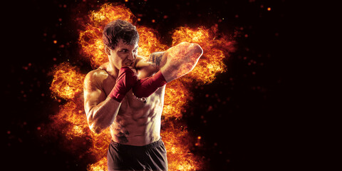 Fototapeta na wymiar Fighter man punching in fire. MMA fighter