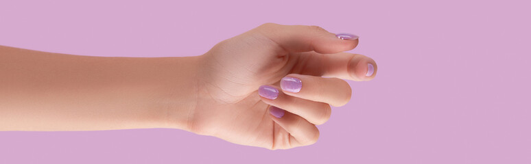 Womans hand with trendy lavender manicure. Spring summer nail design